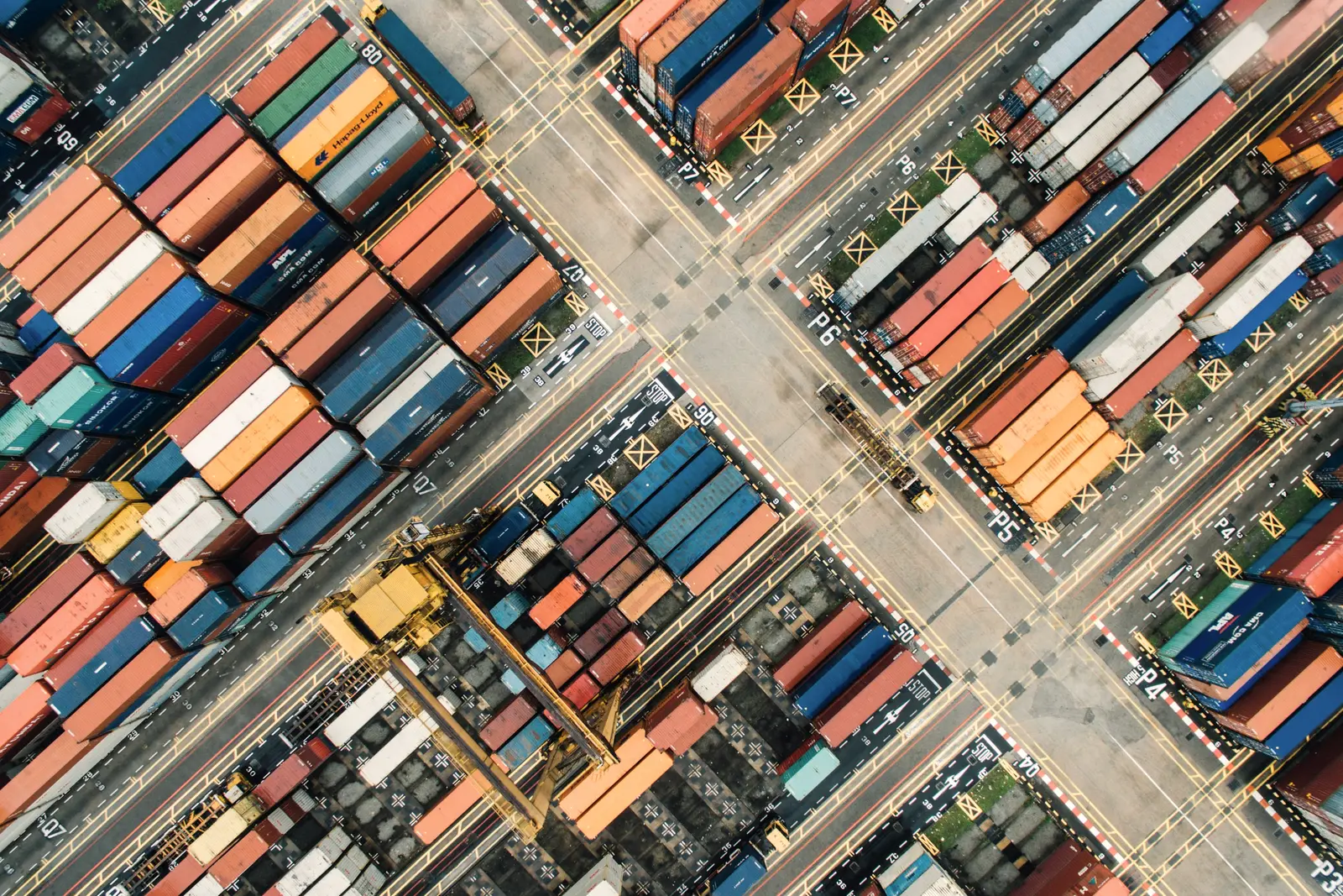 Aerial view of rows of shipping containers in a port yard